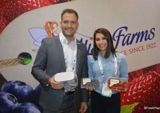 Nick Wishnatzki and Hailey Clark with Wish Farms. Nick holds the equipment for the virtual reailty farm tour for blueberries and strawberries on the company's Florida farms. Hailey shows blueberries and strawberries.